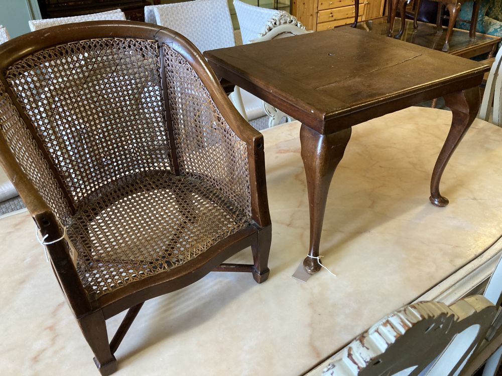 A childs caned mahogany bergere on table stand